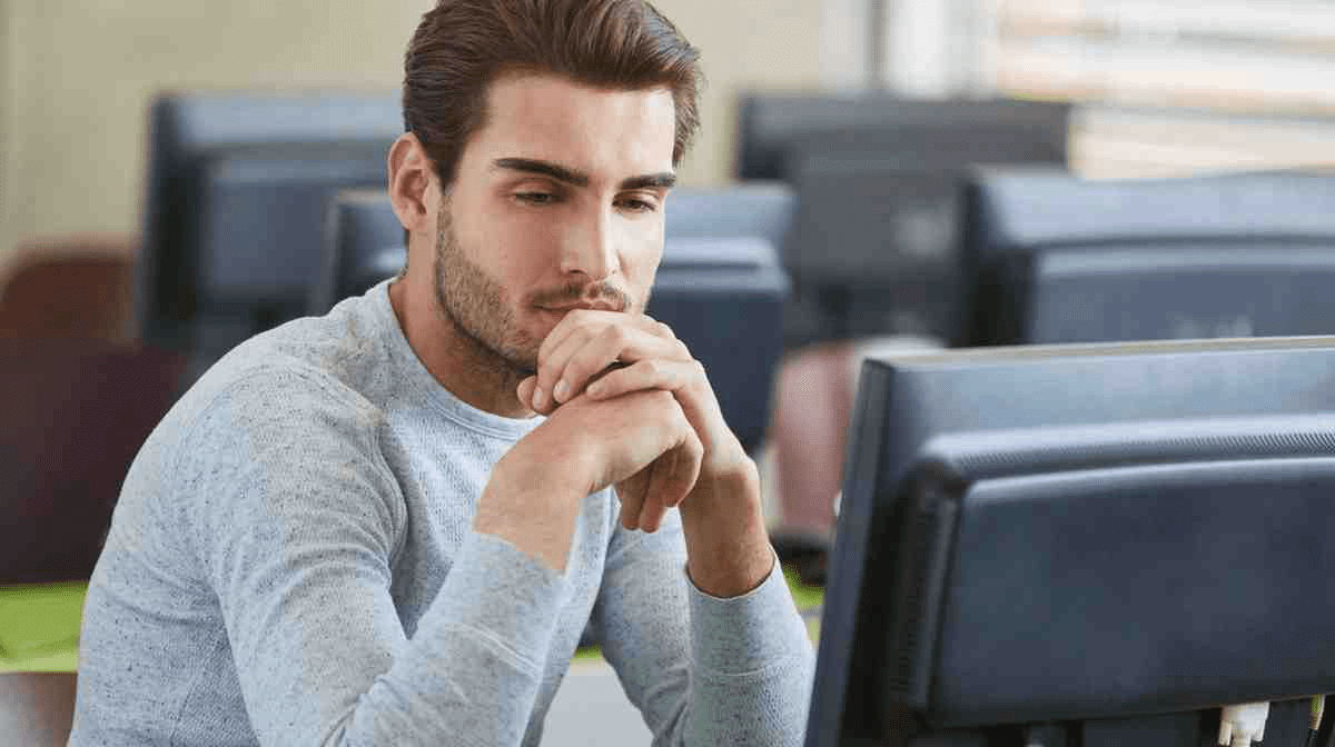 Medical school student taking an old NBME practice exam in a computer room.